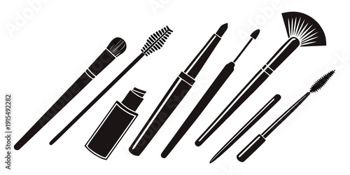 Assorted makeup brushes and tools laid out on a white background Vector