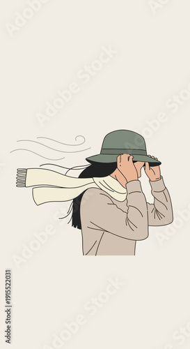 Woman Shielding Face From Gusty Winds With Scarf And Hat