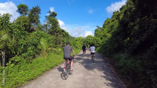 Asia. Vietnam , Ha Long Bay 02,16,2026 Tourists visit Ha Long Bay, a UNESCO World Heritage site, by bicycle - sustainable tourism in one of the seven natural wonders of the world