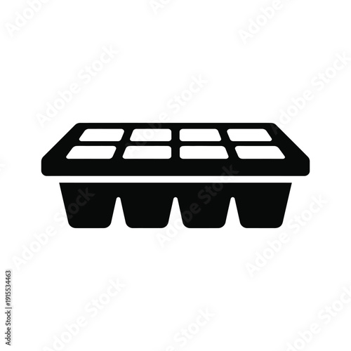 Simple black and white icon silhouette of an ice cube tray with eight rectangular compartments for freezing water or making desserts.