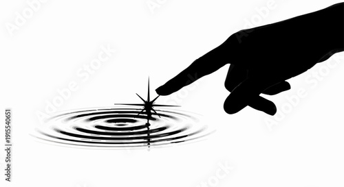 Silhouette of a finger touching water creating ripples and a spark of light