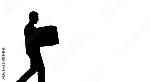 Silhouette of a man carrying a large box.