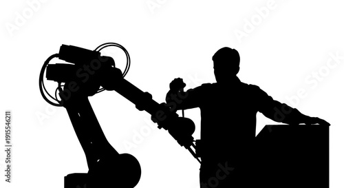 Silhouette of a person operating a robotic arm in a factory setting.