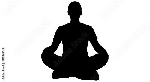 Silhouette of a person meditating in a peaceful pose.