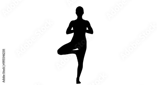 Silhouette of a person performing a yoga tree pose.