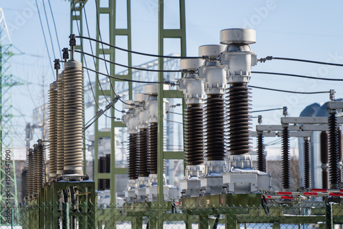 Schilderij op canvas Electric power substation equipment with tall insulator stacks, disconnect switc