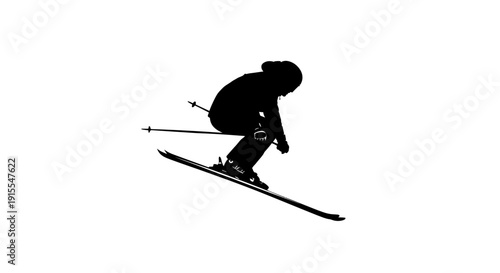 Silhouette of a skier in action on a slope.