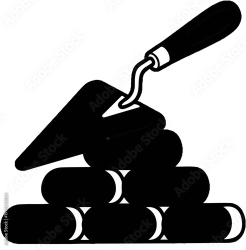 Black silhouette of a trowel with a curved handle, resting on a pile of oblong shapes