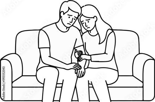 Couple on sofa, heads bowed, looking sad and comforted by touch