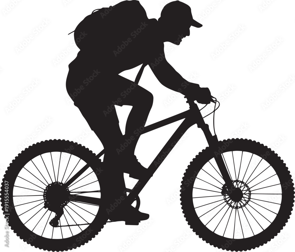 Fototapeta premium Silhouette of a mountain biker with backpack riding on a trail