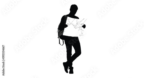 A solitary figure stands holding a folded map appearing to navigate or plan a journey silhouette high quality professional