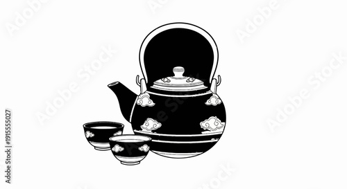 Black teapot with clouds design next to two teacups