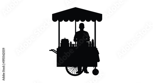 Silhouette of a street food vendor operating from a small cart