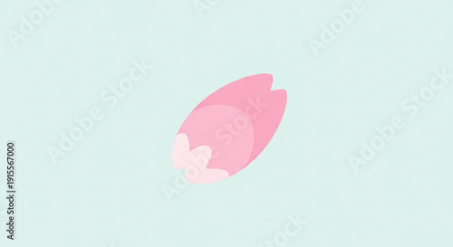 Single pink cherry blossom petal falling gently representing spring and nature isolated on a soft blue background