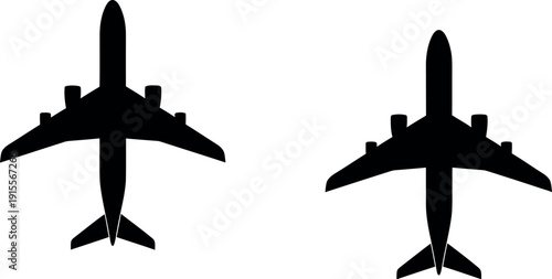 Two airplanes viewed from above in a symmetrical formation on a plain background