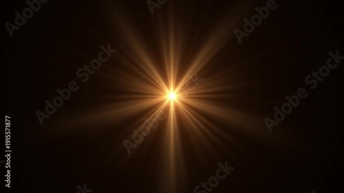 Mystical Twinkling Star with Golden Light Rays Spinning in Darkness