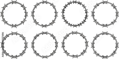 Eight circular frames composed of barbed wire on a white background