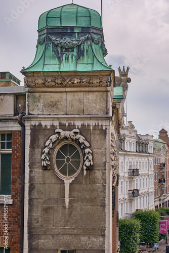 Helsingborg, Sweden - 12 August 2025: View of the old building's corner with a verdigris dome and circular window, standing proud against the muted sky.