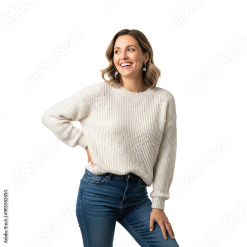 Woman laughing wearing white sweater and blue jeans