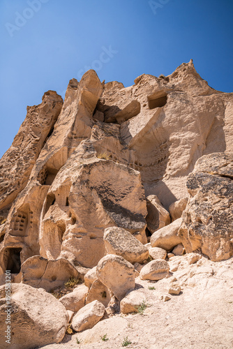 Uchisar castle, a unique historical building formed by carving a huge volcanic rock for defence and and settlement. Cappadocia, Turkey.