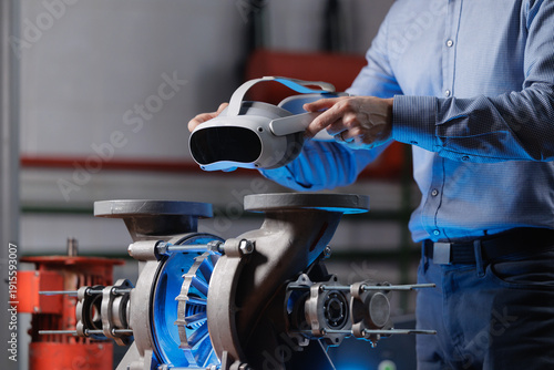 Billede på lærred Engineer using vr headset to inspect turbine industrial machinery