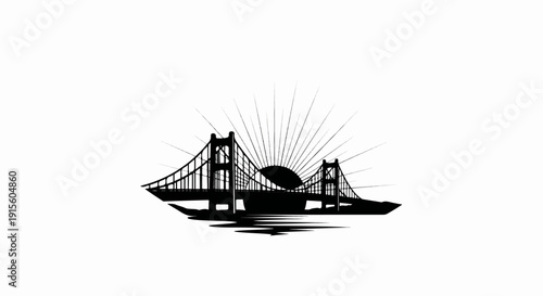 Iconic suspension bridge silhouette against a radiant sun and water reflection
