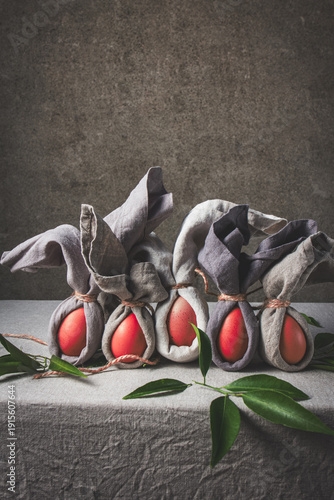 Easter table set with decorated eggs and bunny themed napkins for spring celebration at home