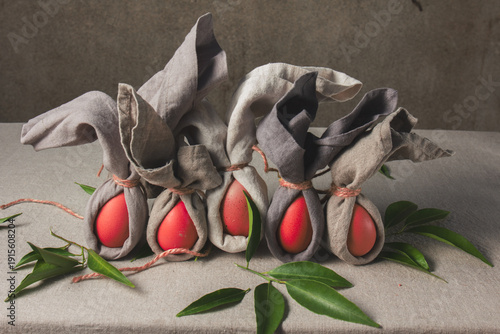 Easter table set with decorated eggs and bunny themed napkins for spring celebration at home