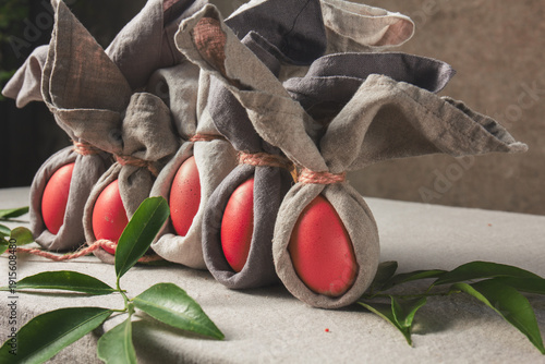 Easter table set with decorated eggs and bunny themed napkins for spring celebration at home