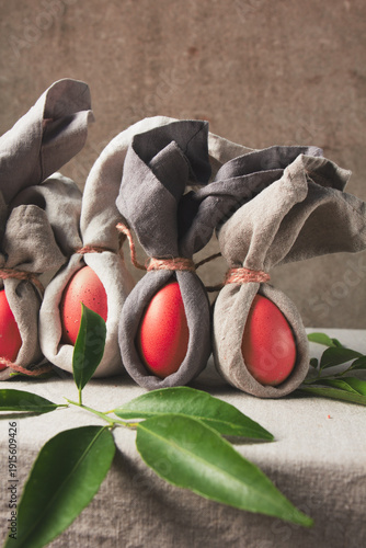 Easter table set with decorated eggs and bunny themed napkins for spring celebration at home