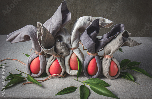 Easter table set with decorated eggs and bunny themed napkins for spring celebration at home