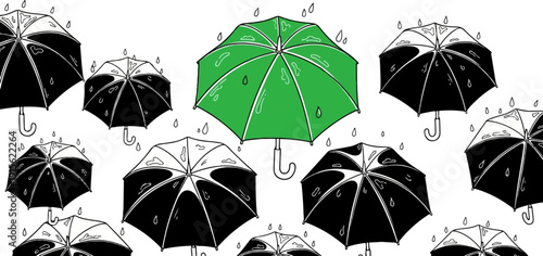 Multiple umbrellas, one green, in a rain shower