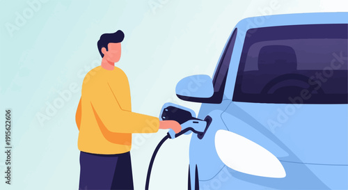 Man charging light blue electric car