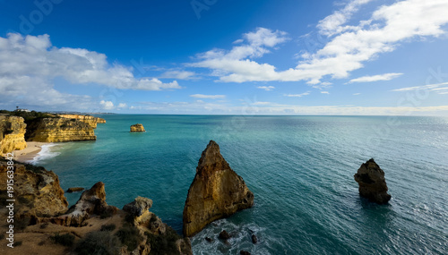 Landscape with natural arch, near Praia da Marinha, one of the most famous place of Portugal, located on the Atlantic coast in Lagoa, Algarve