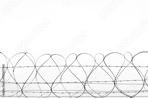 Photos barbed wire against the blue sky