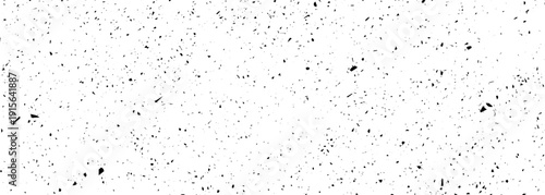 Monochrome grunge overlay texture. Contains noise particles, spots, and streaks, creating a distressed coating effect. Suitable for digital designs, backgrounds, and overlay effects
