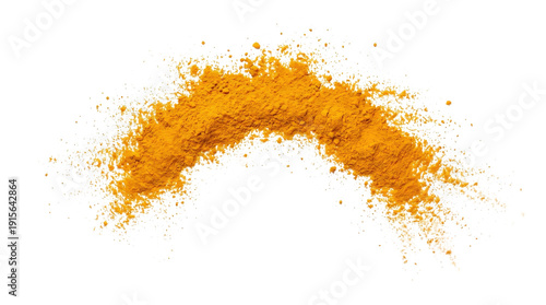 Arc of bright orange turmeric powder scattering in air with fine spice particles falling