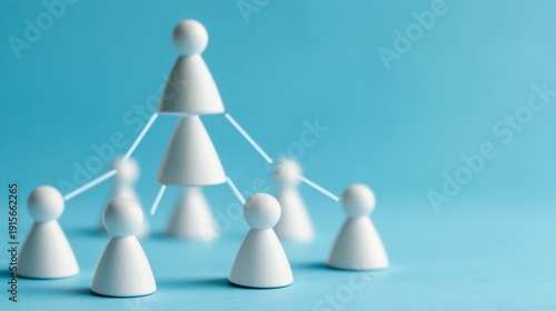 White pawn-like figures connected in a hierarchical structure, symbolizing team, organization and connection on a blue background. Organization, Network
