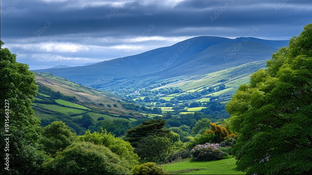 Obraz premium Green Hills Stretch Across the Irish Landscape Under a Cloudy Sky During the Day