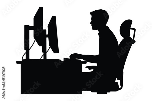 Silhouette of Man Working on Computer in Office