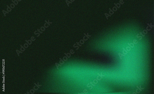 Abstract luminous green glow on a dark background suggesting a futuristic or scientific theme