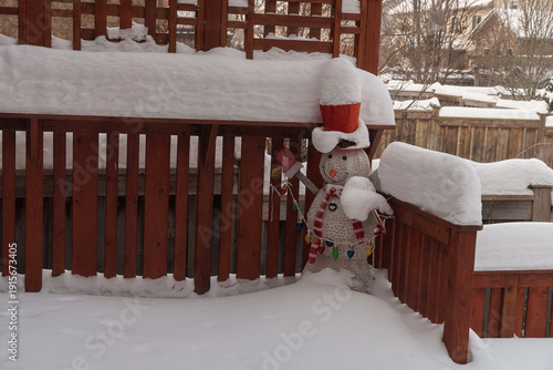 Festive Decorative Snowman Standing in Deep Winter Snow