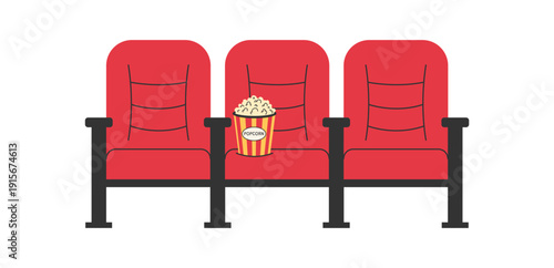 Row of red cinema seats with popcorn bucket. Movie theater auditorium seating for screening and movie night concept