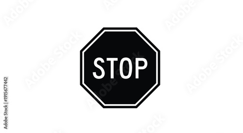 A classic black and white octagonal stop sign with white lettering