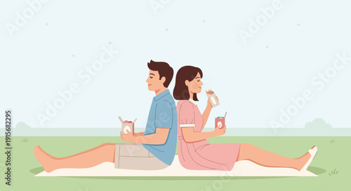 Couple Enjoying A Picnic Meal Outdoors On A Sunny Day