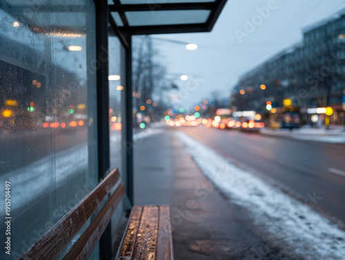 Wallpaper Mural Empty bus stop bench in cold winter evening with blurred city street lights and light snow on the sidewalk creating a quiet urban atmosphere Torontodigital.ca