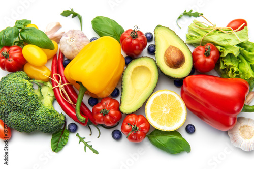 Assortment of fresh organic vegetables and fruits on white
