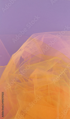 Bright orange tulle fabric on purple background.  Abstract transparent material curve wave.