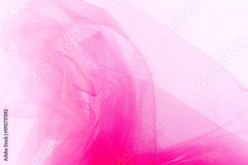 Bright pink tulle fabric background.  Abstract transparent material curve wave.