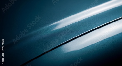 Close-up of sleek blue car surface with reflective light
